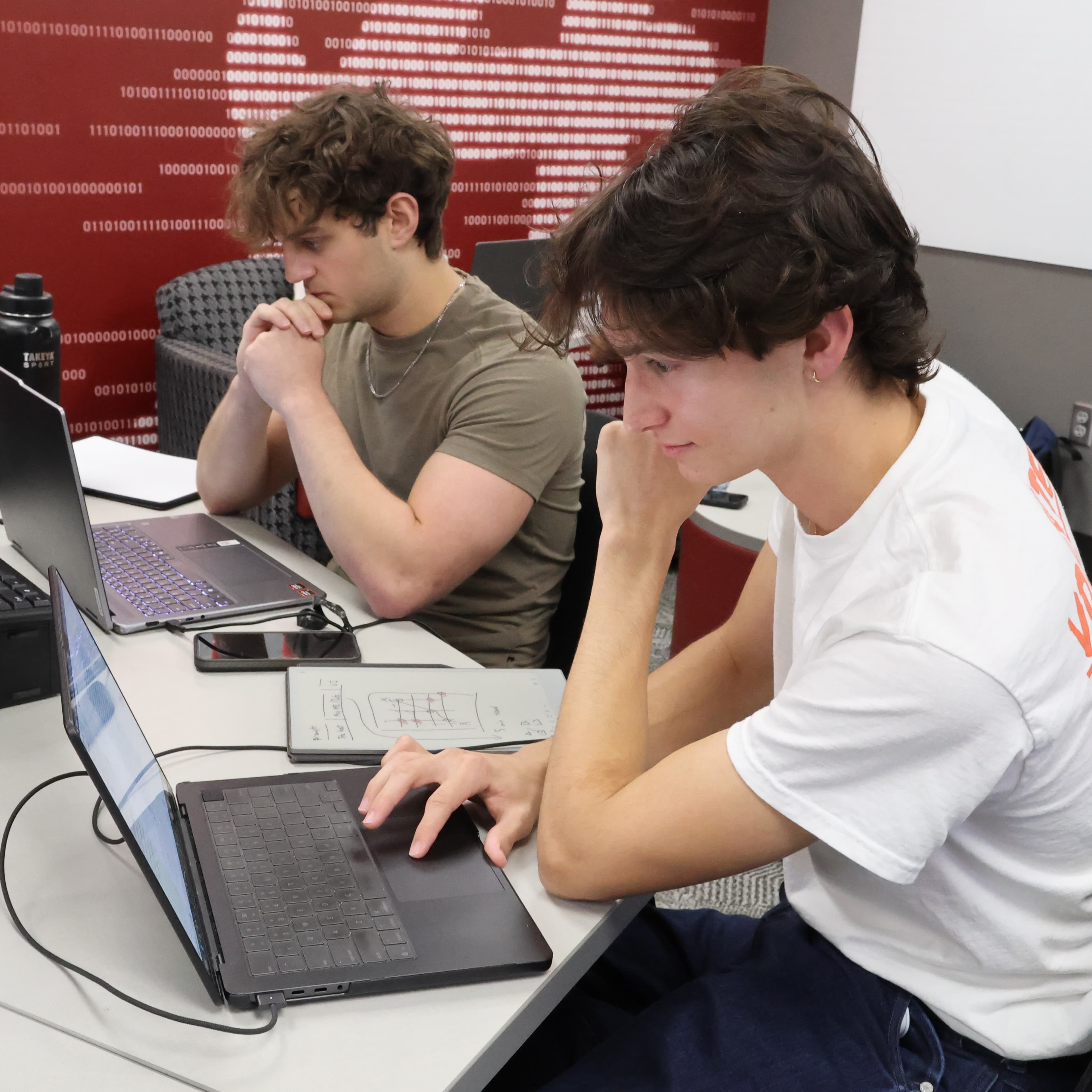 Working through a problem together.